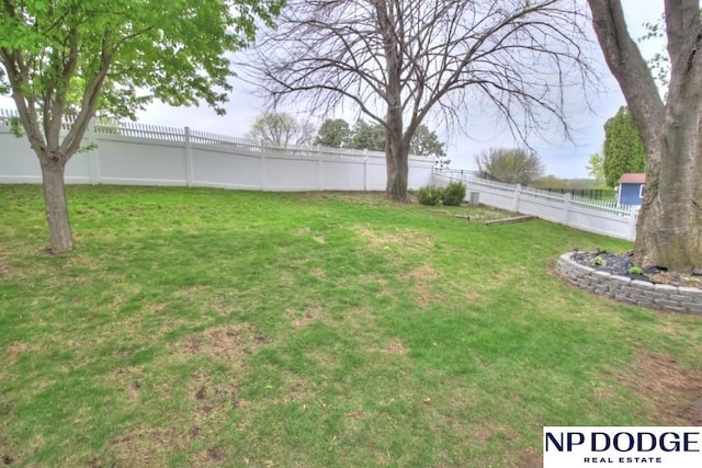view of yard with a fenced backyard