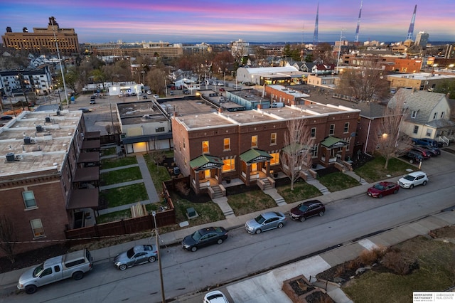 birds eye view of property with a view of city