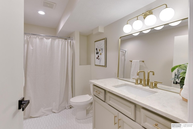 bathroom with vanity, visible vents, toilet, curtained shower, and tile patterned floors