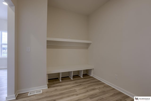 11014 N 161st St, Bennington, NE 68007 - mudroom featuring wood finished floors, baseboards, and visible vents