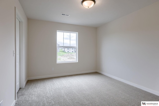 11014 N 161st St, Bennington, NE 68007 - carpeted spare room featuring visible vents and baseboards