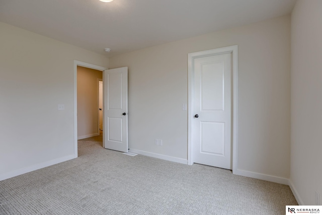 11014 N 161st St, Bennington, NE 68007 - unfurnished bedroom with baseboards and light colored carpet