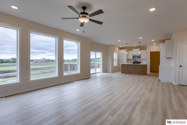 11014 N 161st St, Bennington, NE 68007 - unfurnished living room with ceiling fan, recessed lighting, and light wood-style floors