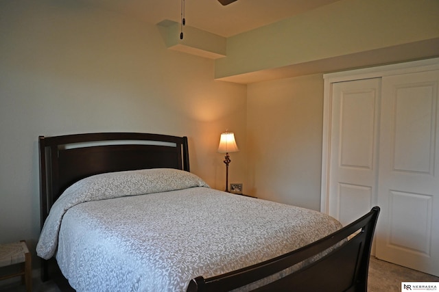 bedroom featuring a closet and light colored carpet