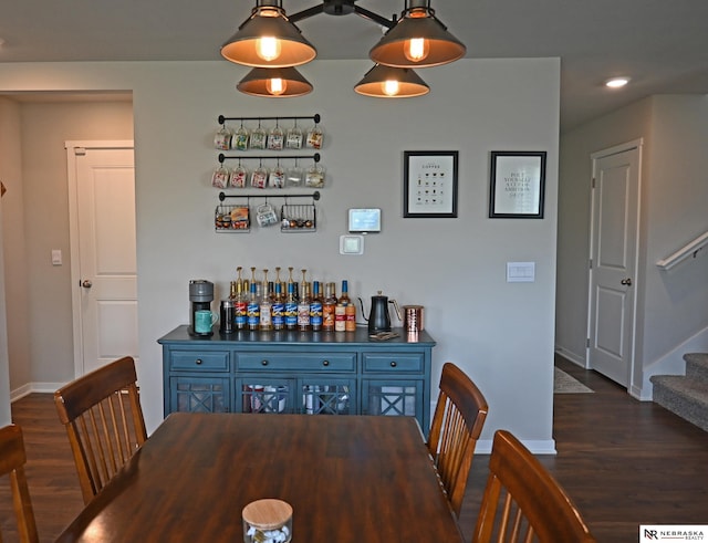 dining area with dark wood-type flooring, recessed lighting, baseboards, and stairs