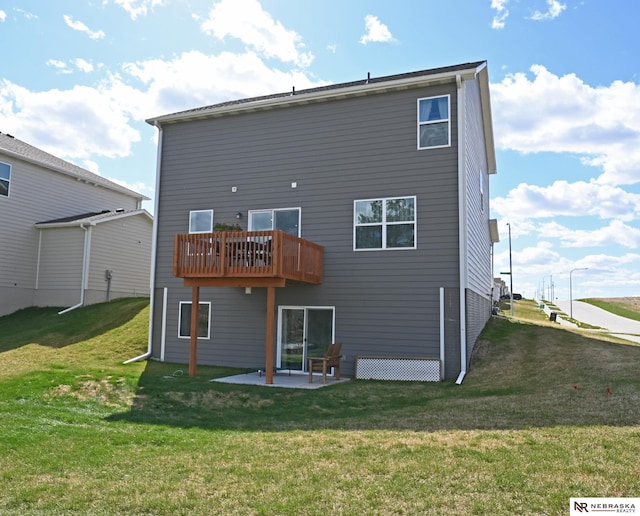 back of property with a patio and a yard