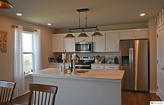 kitchen featuring stainless steel appliances, recessed lighting, dark wood-style flooring, and light countertops