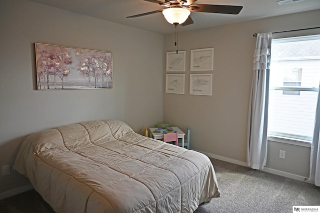 bedroom with carpet floors, baseboards, a ceiling fan, and visible vents