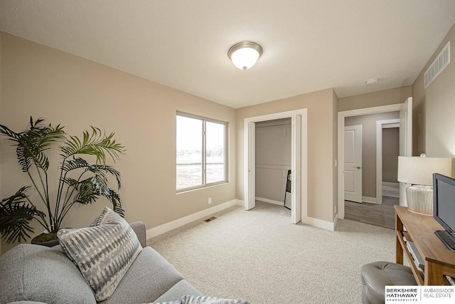 17045 Hawthorne Ave, Omaha, NE 68118 - living room featuring light carpet, visible vents, and baseboards