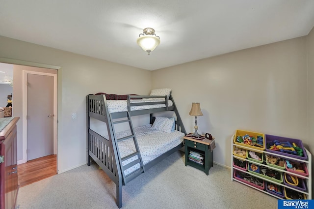 carpeted bedroom with baseboards
