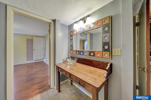 bathroom featuring tile patterned floors and baseboards