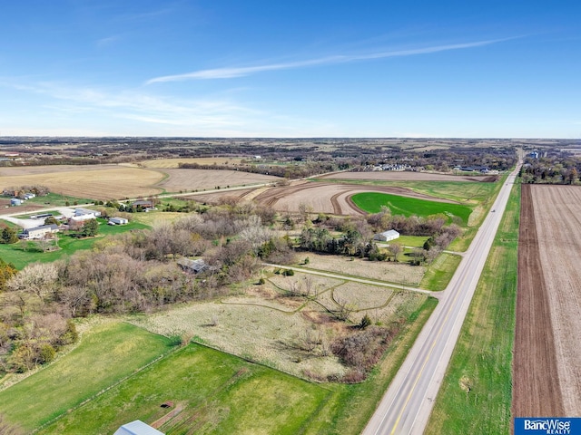 birds eye view of property with a rural view