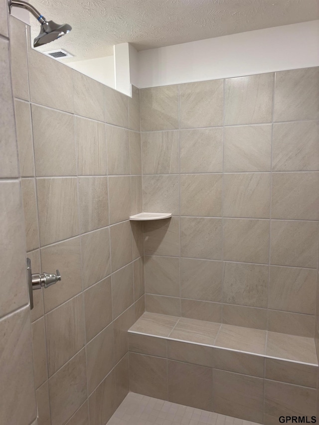 5412 N 190th Ave, Elkhorn, NE 68022 - full bathroom with a textured ceiling and tiled shower