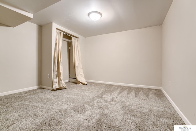 unfurnished bedroom with baseboards and carpet