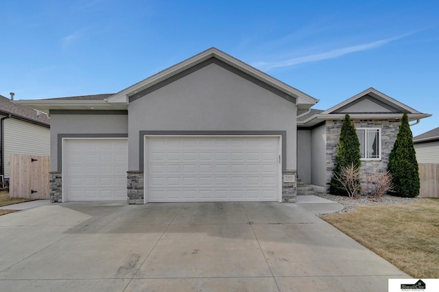 ranch-style home featuring stucco siding, stone siding, and an attached garage