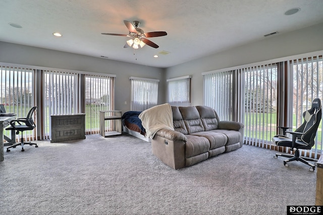 living room featuring visible vents, a ceiling fan, carpet, and recessed lighting