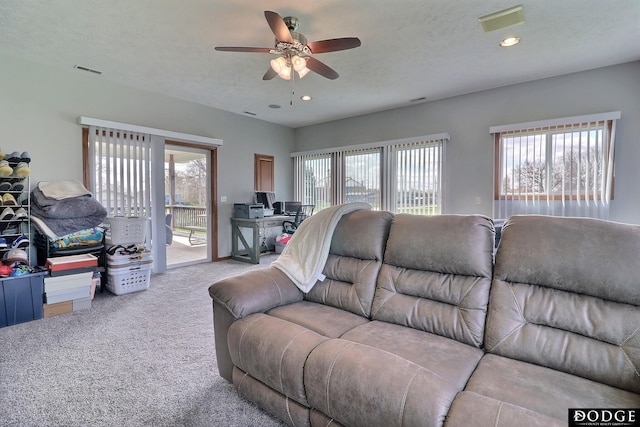 living area featuring recessed lighting, carpet, visible vents, and a ceiling fan