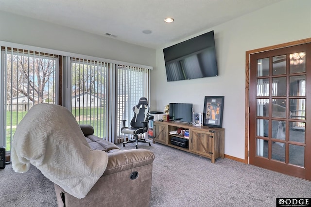 carpeted living room with visible vents