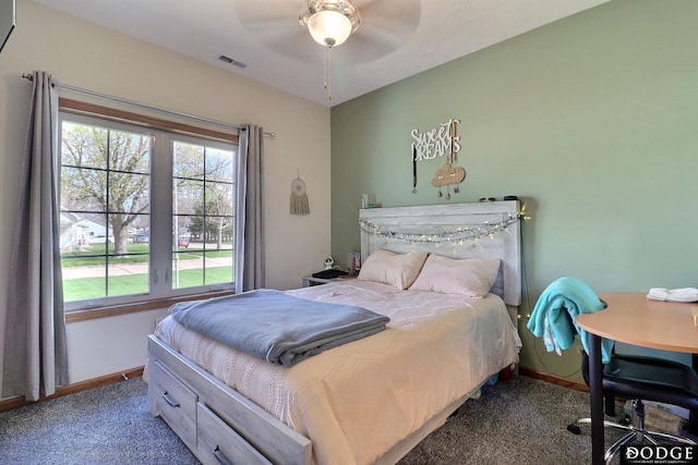 bedroom featuring visible vents, baseboards, ceiling fan, and carpet