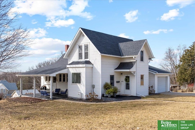 view of side of property with a shingled roof, a patio area, an attached garage, and a lawn