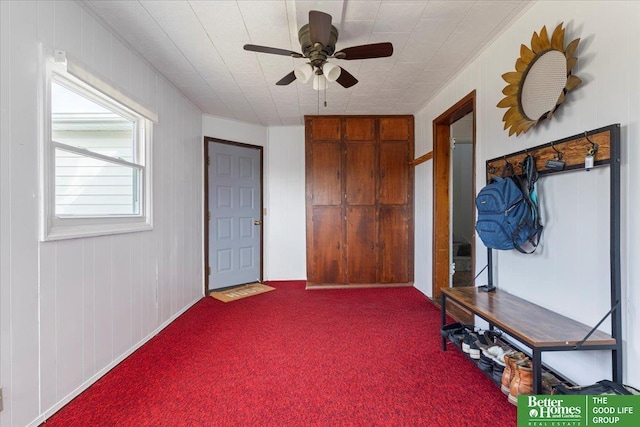 entrance foyer with carpet flooring and ceiling fan