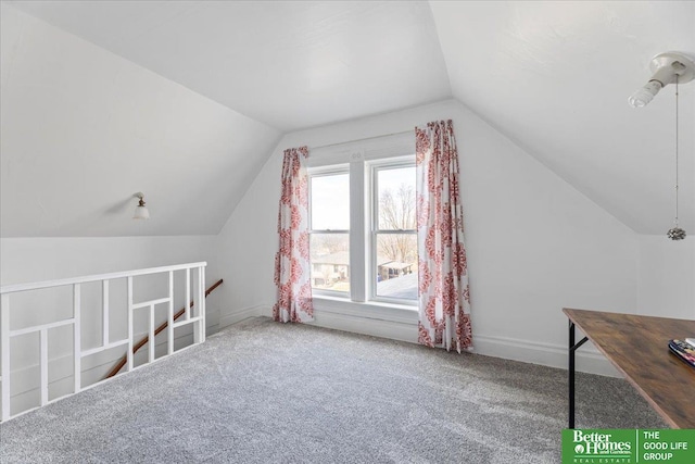 bonus room with carpet flooring, baseboards, and lofted ceiling