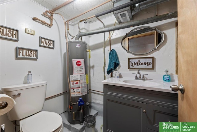 bathroom featuring water heater, toilet, and vanity