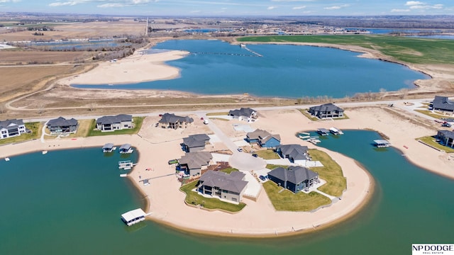 birds eye view of property featuring a residential view and a water view