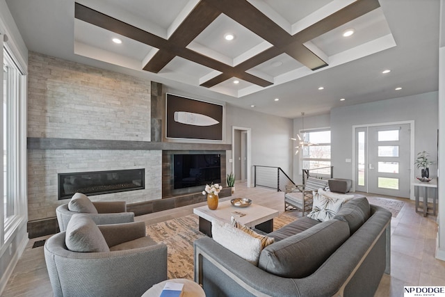 living area featuring recessed lighting, a large fireplace, beamed ceiling, and coffered ceiling