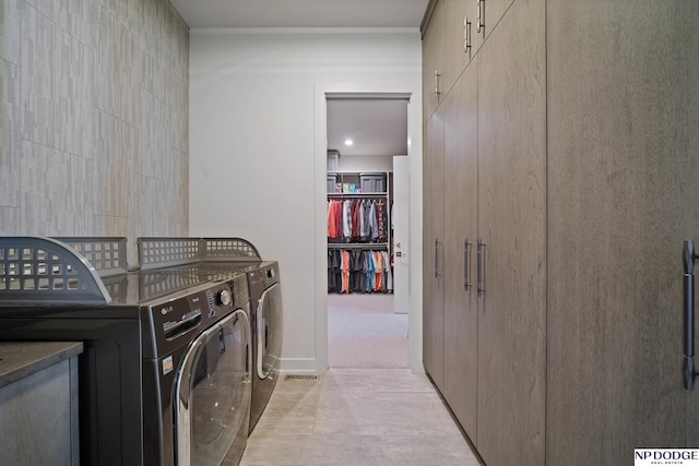 washroom with washer and dryer and laundry area