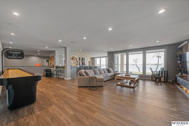 living room with recessed lighting and wood finished floors
