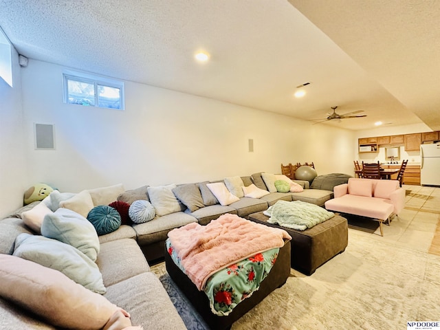living room featuring visible vents, ceiling fan, and recessed lighting