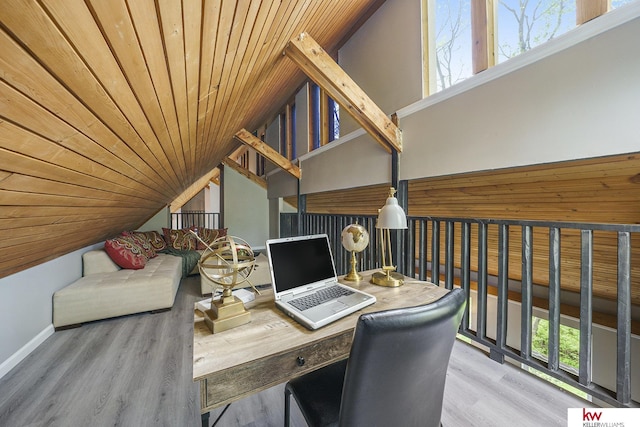 office space featuring wooden ceiling, baseboards, wood finished floors, and lofted ceiling