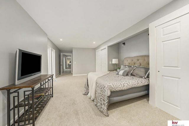 carpeted bedroom featuring recessed lighting, baseboards, and a closet