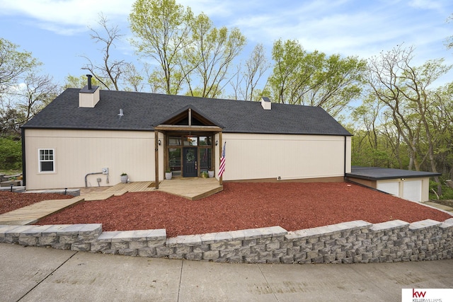 view of front of house featuring a chimney