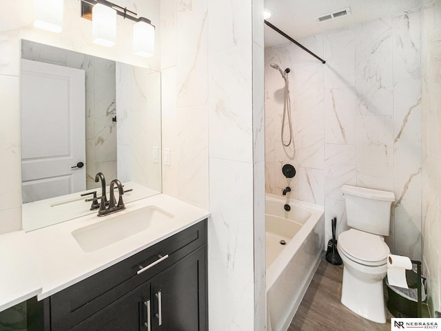 11731 N 144th St, Waverly, NE 68462 - bathroom with tile walls, vanity, shower / washtub combination, toilet, and wood finished floors