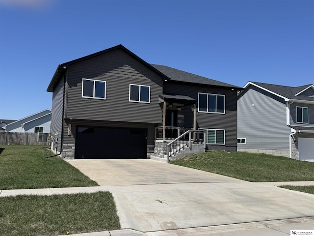 11731 N 144th St, Waverly, NE 68462 - view of front facade with driveway, an attached garage, and stone siding