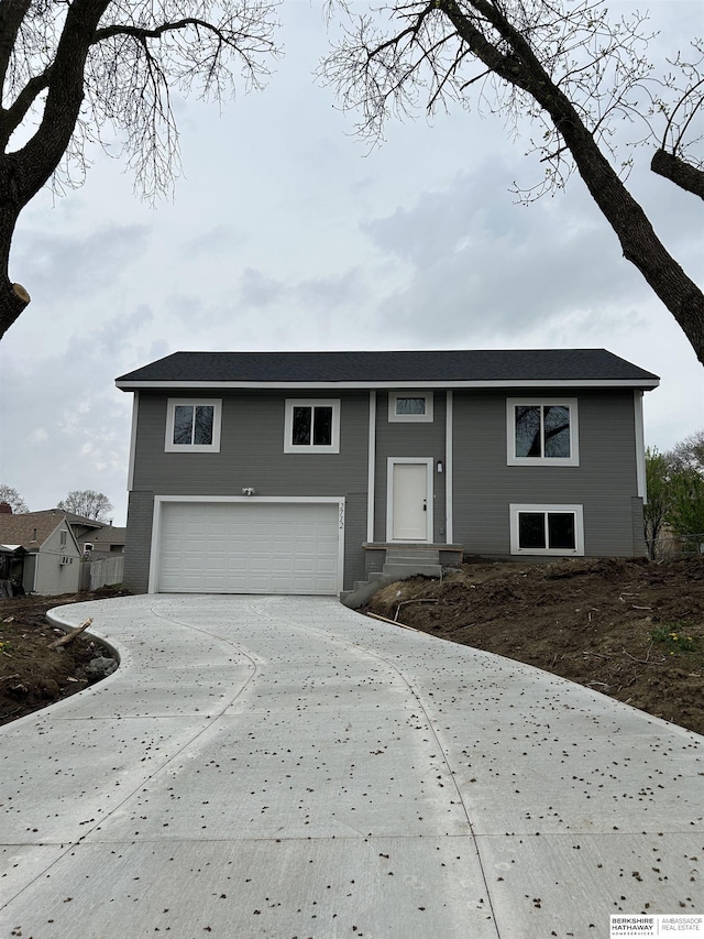 view of front of property with a garage and driveway