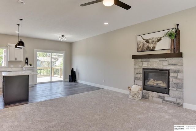 unfurnished living room featuring baseboards, ceiling fan, carpet, and recessed lighting