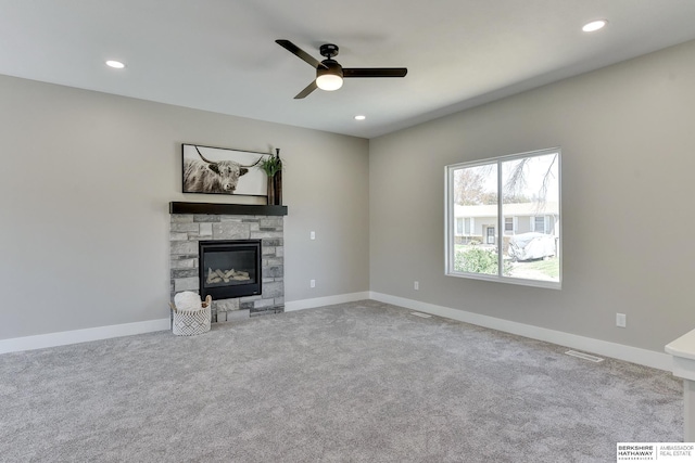 unfurnished living room featuring recessed lighting, a ceiling fan, carpet flooring, and a fireplace