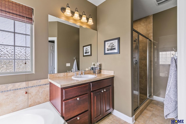 full bath featuring visible vents, a shower stall, tile patterned flooring, and vanity