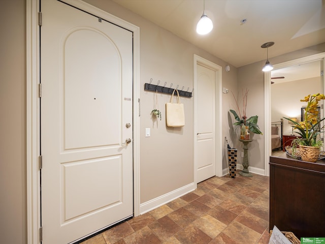 210 S 16th St Unit 901, Omaha, NE 68102 - hallway featuring baseboards and dark stone finish floors