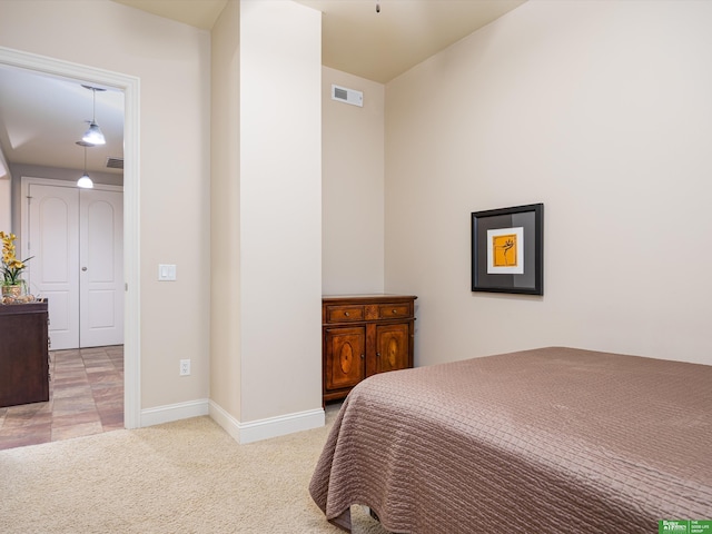 210 S 16th St Unit 901, Omaha, NE 68102 - bedroom featuring light carpet and baseboards