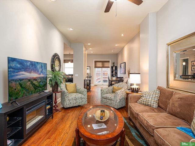 210 S 16th St Unit 901, Omaha, NE 68102 - living area featuring wood finished floors, a ceiling fan, and recessed lighting