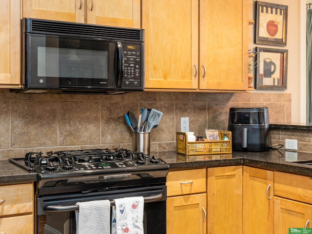 210 S 16th St Unit 901, Omaha, NE 68102 - kitchen featuring black appliances, backsplash, and dark stone countertops