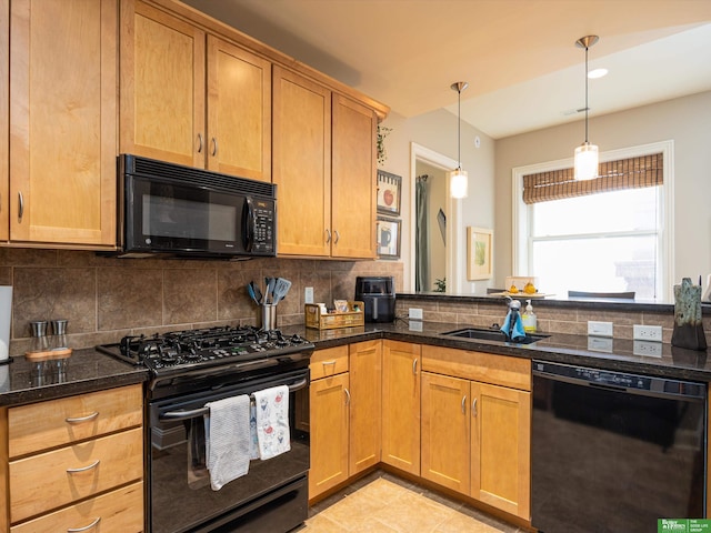 210 S 16th St Unit 901, Omaha, NE 68102 - kitchen with black appliances, a sink, backsplash, and dark stone countertops
