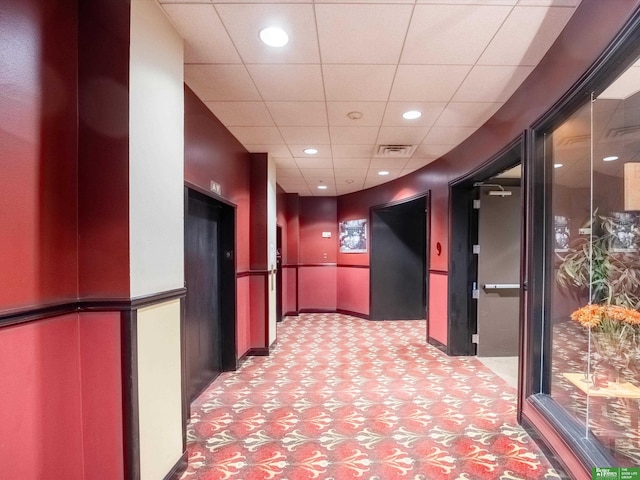210 S 16th St Unit 901, Omaha, NE 68102 - hallway with a paneled ceiling, elevator, carpet, and recessed lighting
