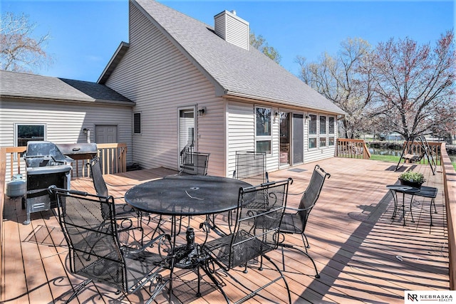 deck with outdoor dining space