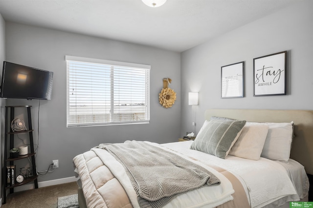 bedroom featuring baseboards and carpet floors
