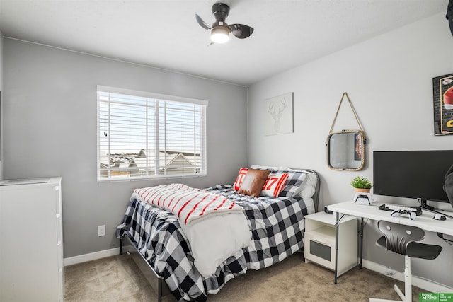 bedroom with baseboards and carpet